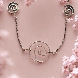 Silpada “Ride the Wave” Silver Swirl Necklace
N1942.  18 to 20 inches